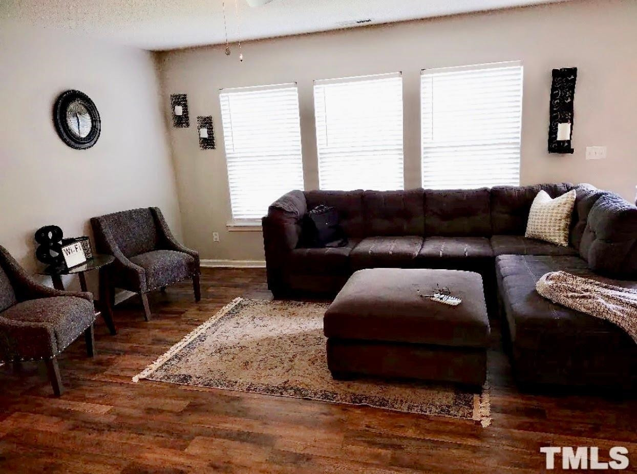 6041 Ricker Road Raleigh, NC 27610 - Photo 7 of 20 a living room with furniture and a window