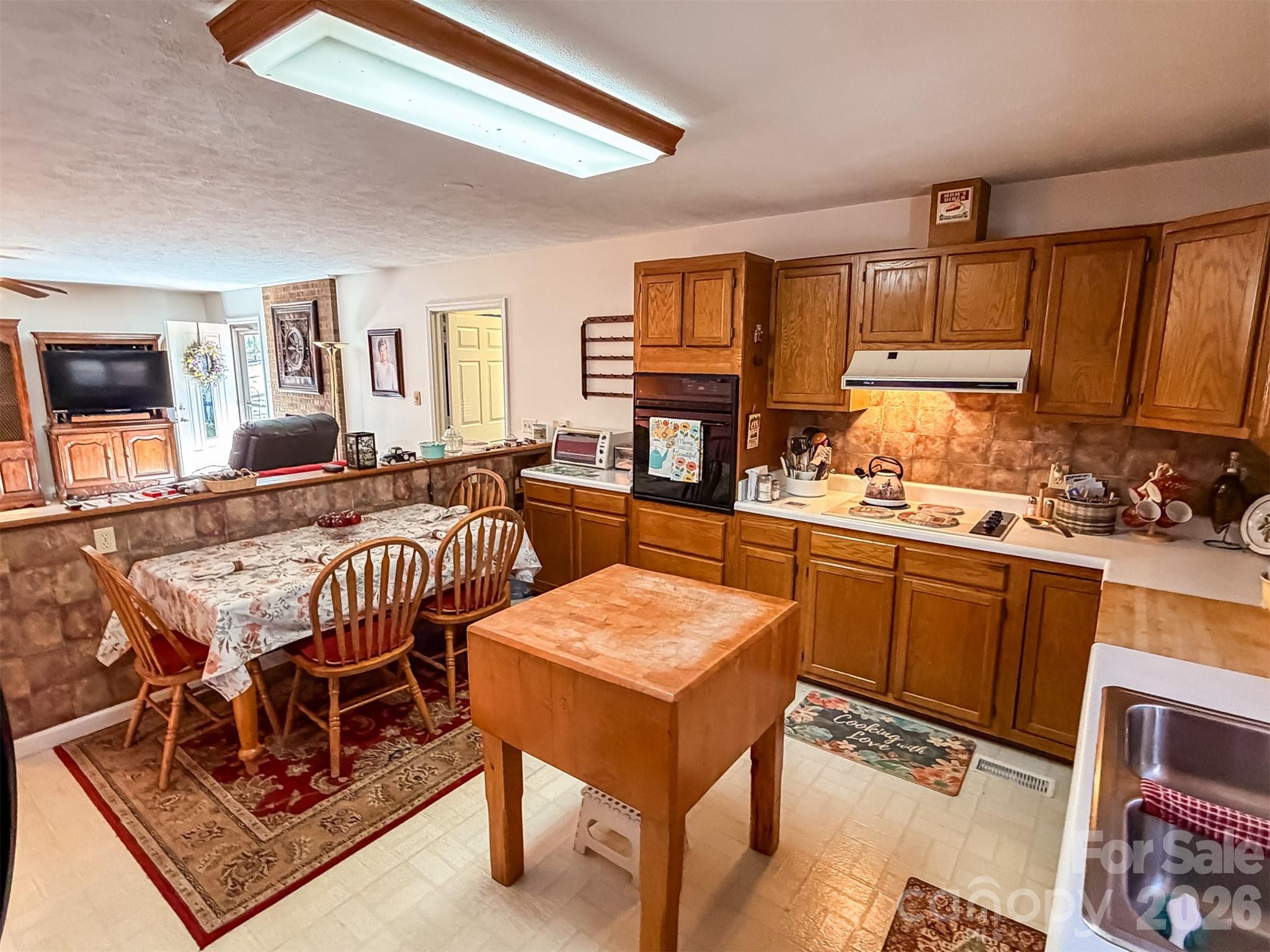1017 3rd Avenue Northwest Conover, NC 28613 - Photo 14 of 46 a living room with stainless steel appliances furniture a rug and a window