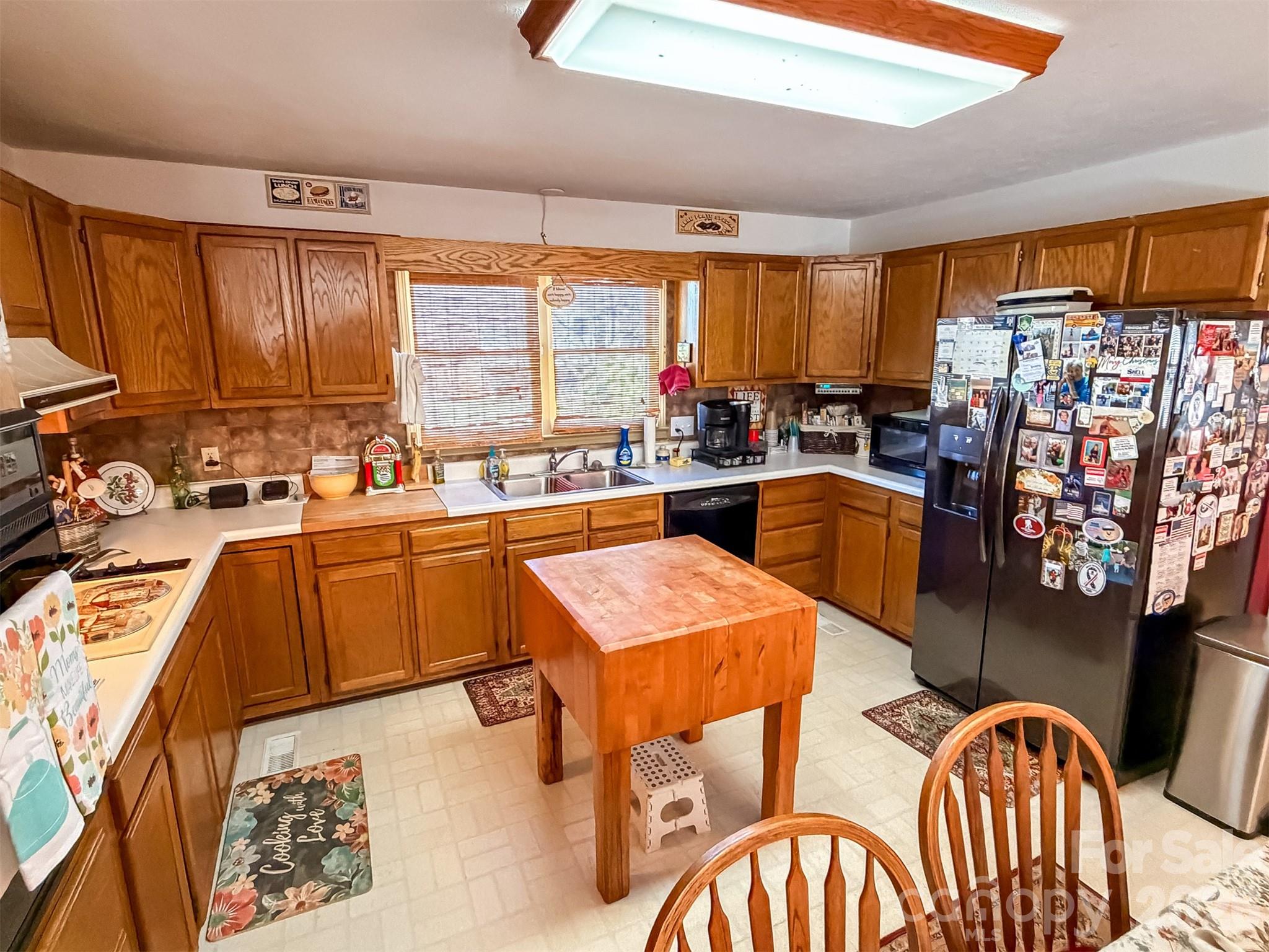 1017 3rd Avenue Northwest Conover, NC 28613 - Photo 16 of 46 a kitchen with a table chairs stove and sink
