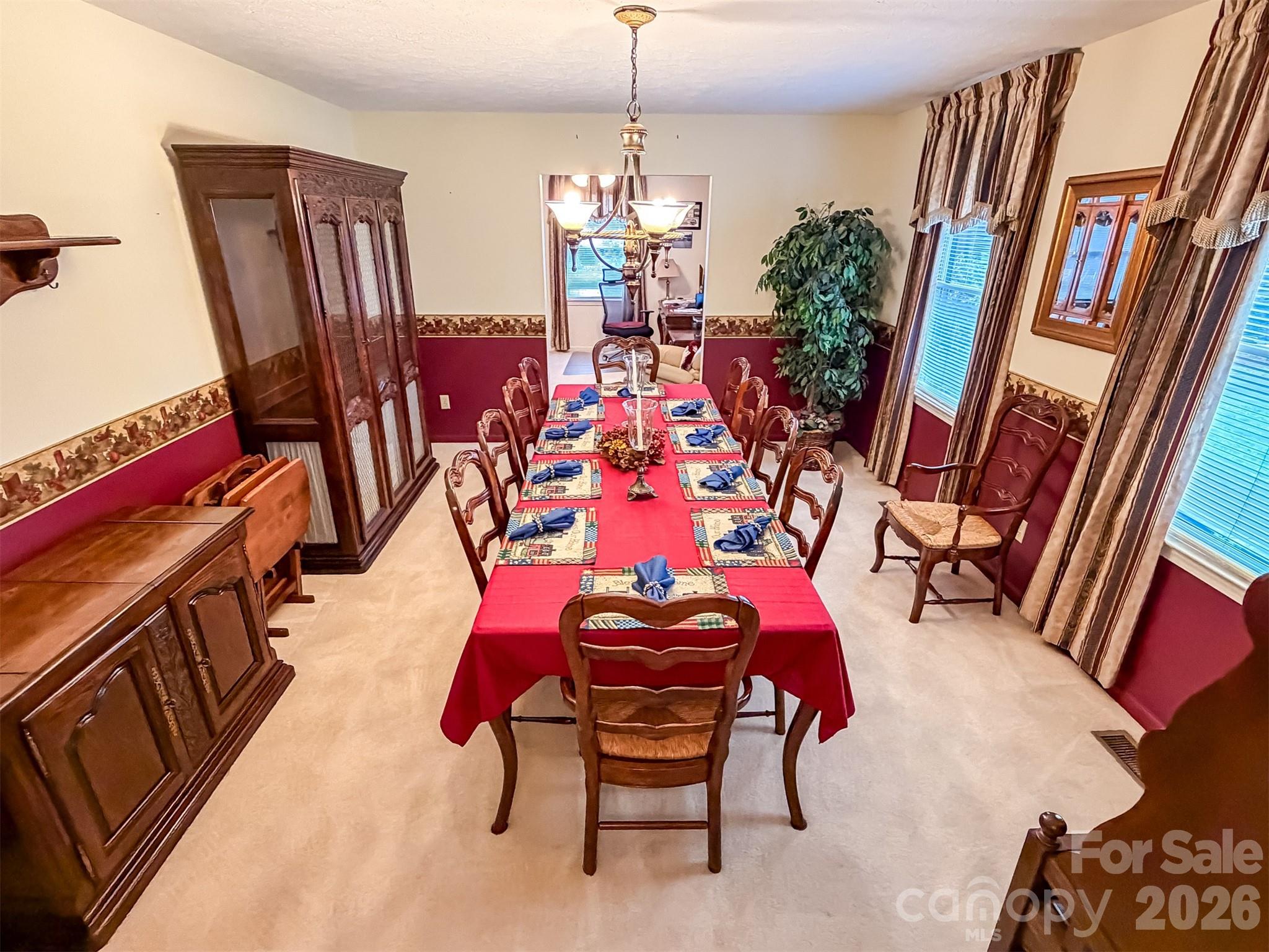 1017 3rd Avenue Northwest Conover, NC 28613 - Photo 19 of 46 a living room with furniture and a chandelier