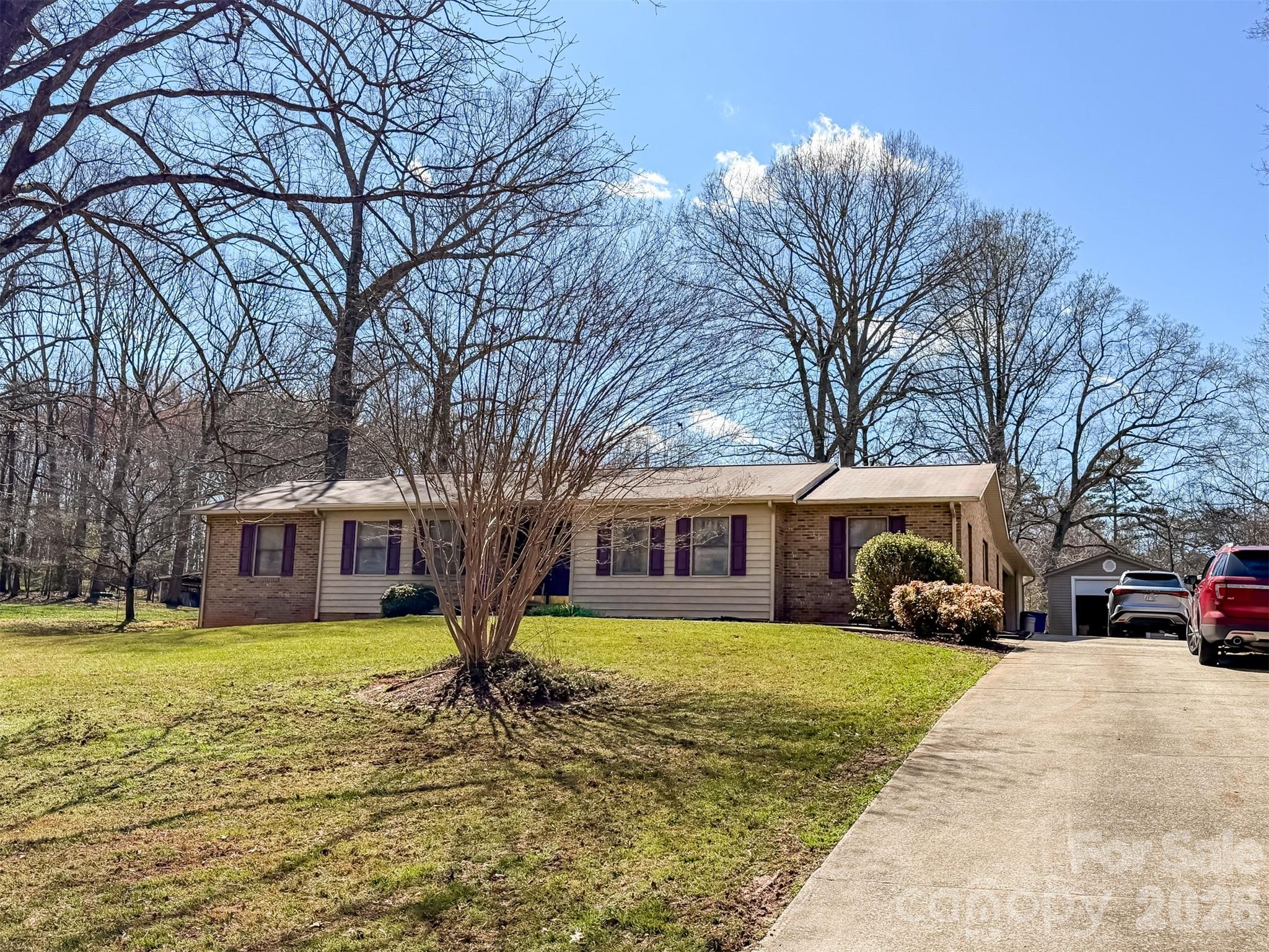 1017 3rd Avenue Northwest Conover, NC 28613 - Photo 2 of 46 a view of a white house with a large tree in front of a house