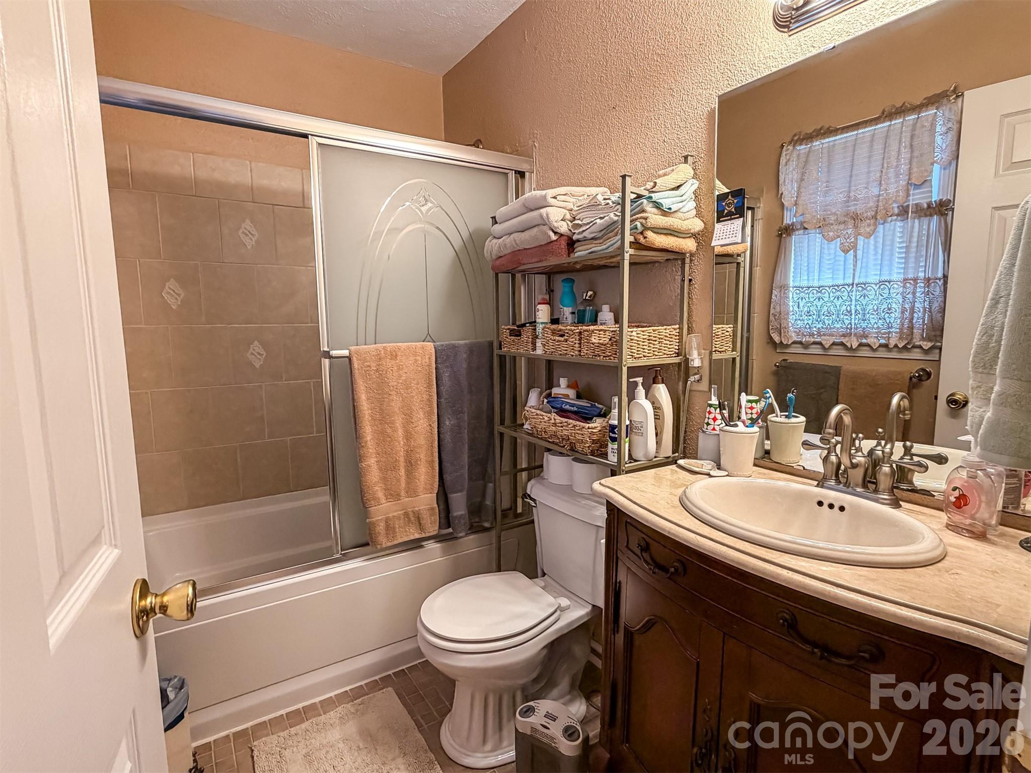 1017 3rd Avenue Northwest Conover, NC 28613 - Photo 27 of 46 a bathroom with a sink toilet and shower
