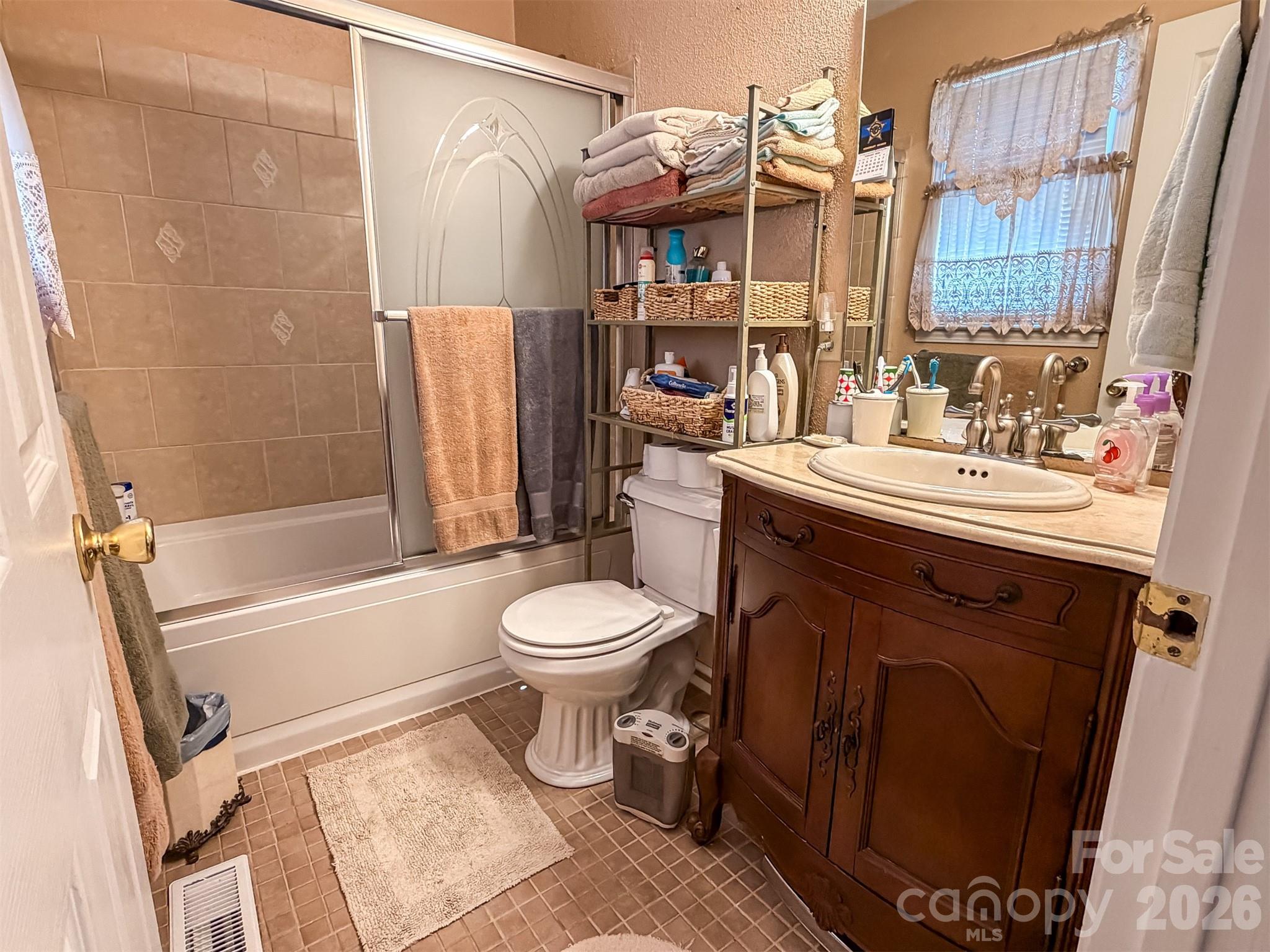 1017 3rd Avenue Northwest Conover, NC 28613 - Photo 28 of 46 a bathroom with a sink toilet and shower