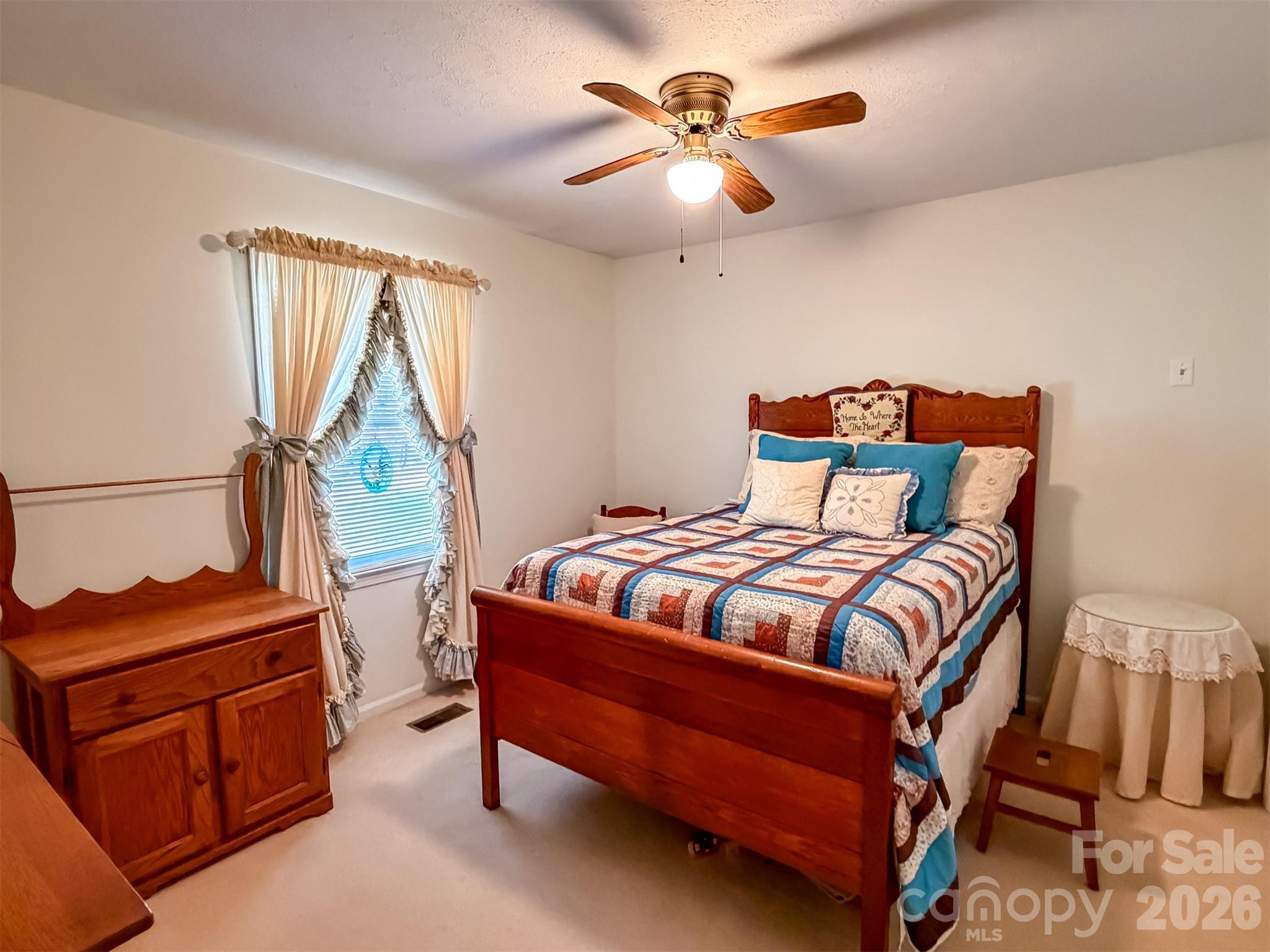 1017 3rd Avenue Northwest Conover, NC 28613 - Photo 29 of 46 a bedroom with a bed and a chandelier