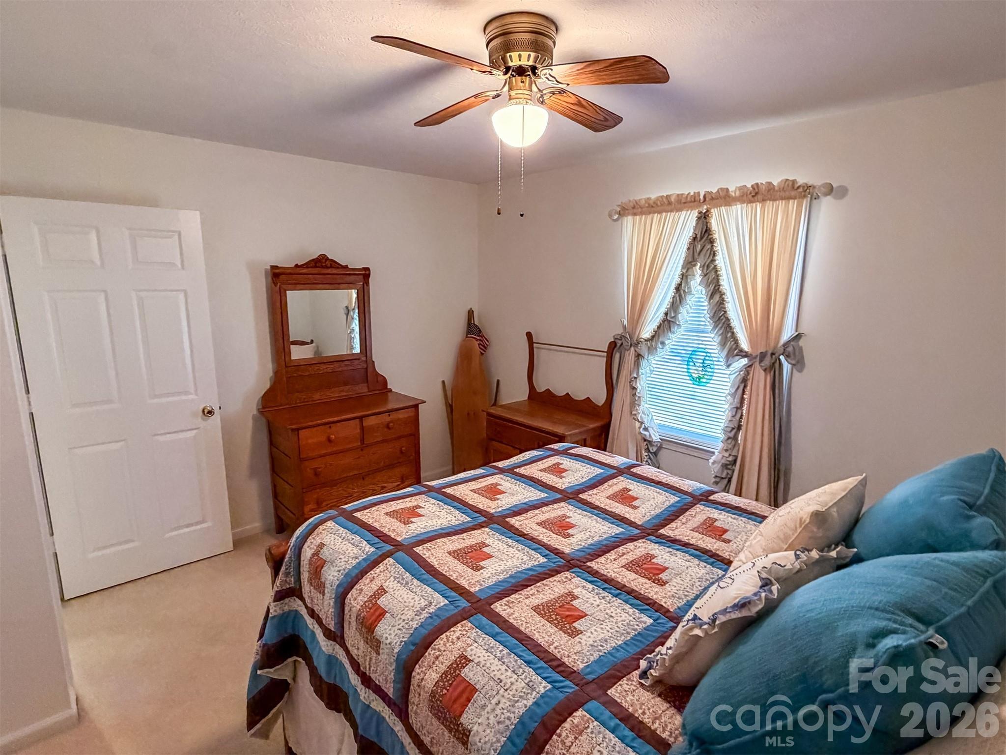 1017 3rd Avenue Northwest Conover, NC 28613 - Photo 32 of 46 a bedroom with a bed and a chandelier