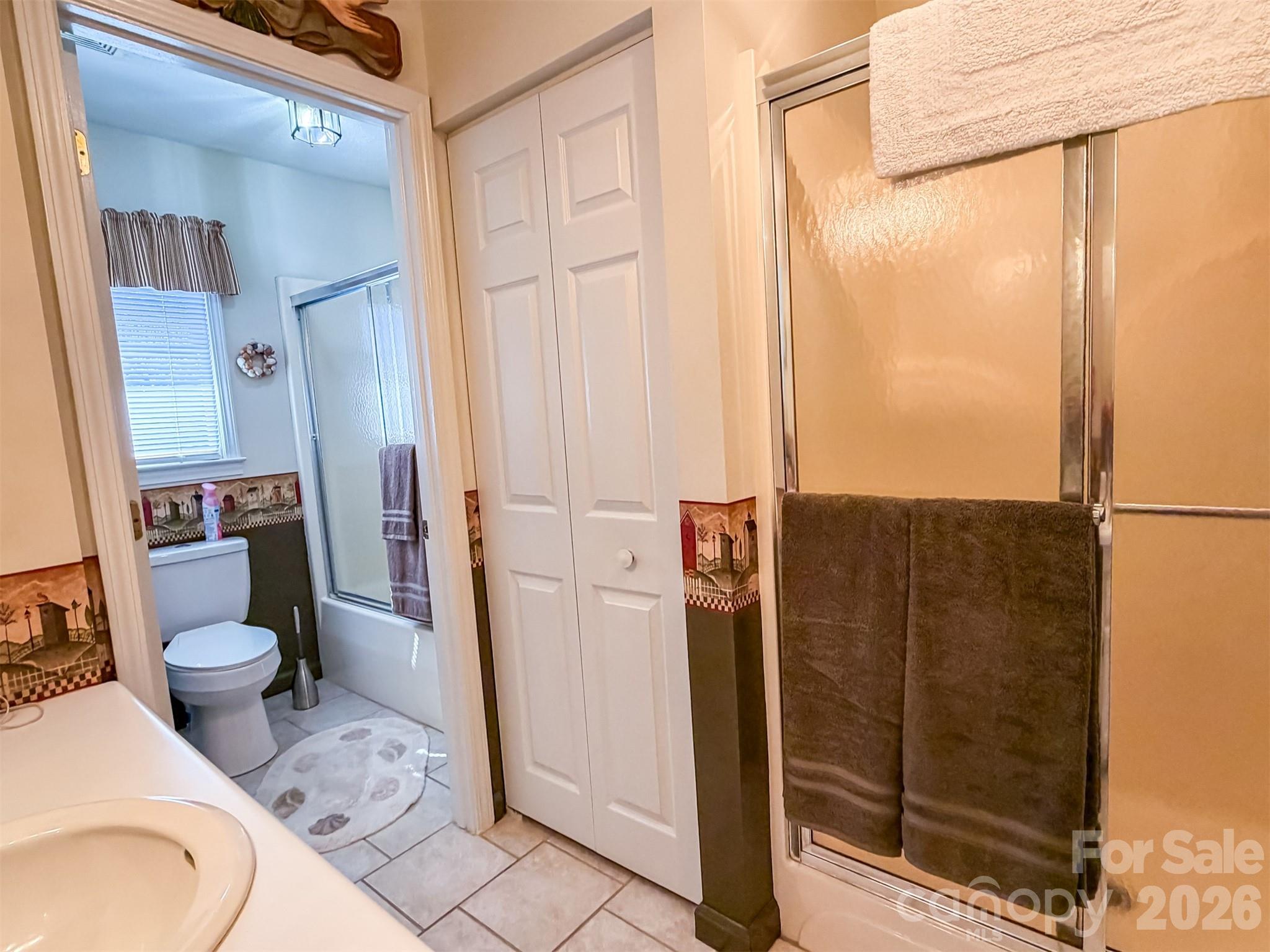 1017 3rd Avenue Northwest Conover, NC 28613 - Photo 35 of 46 a bathroom with a granite countertop shower a toilet and a sink