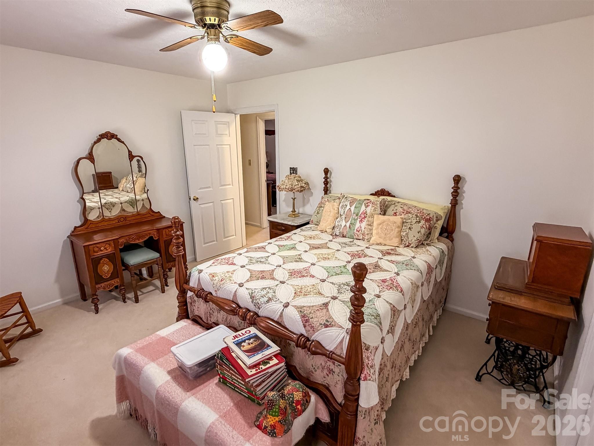 1017 3rd Avenue Northwest Conover, NC 28613 - Photo 39 of 46 a bedroom with a bed and a chandelier