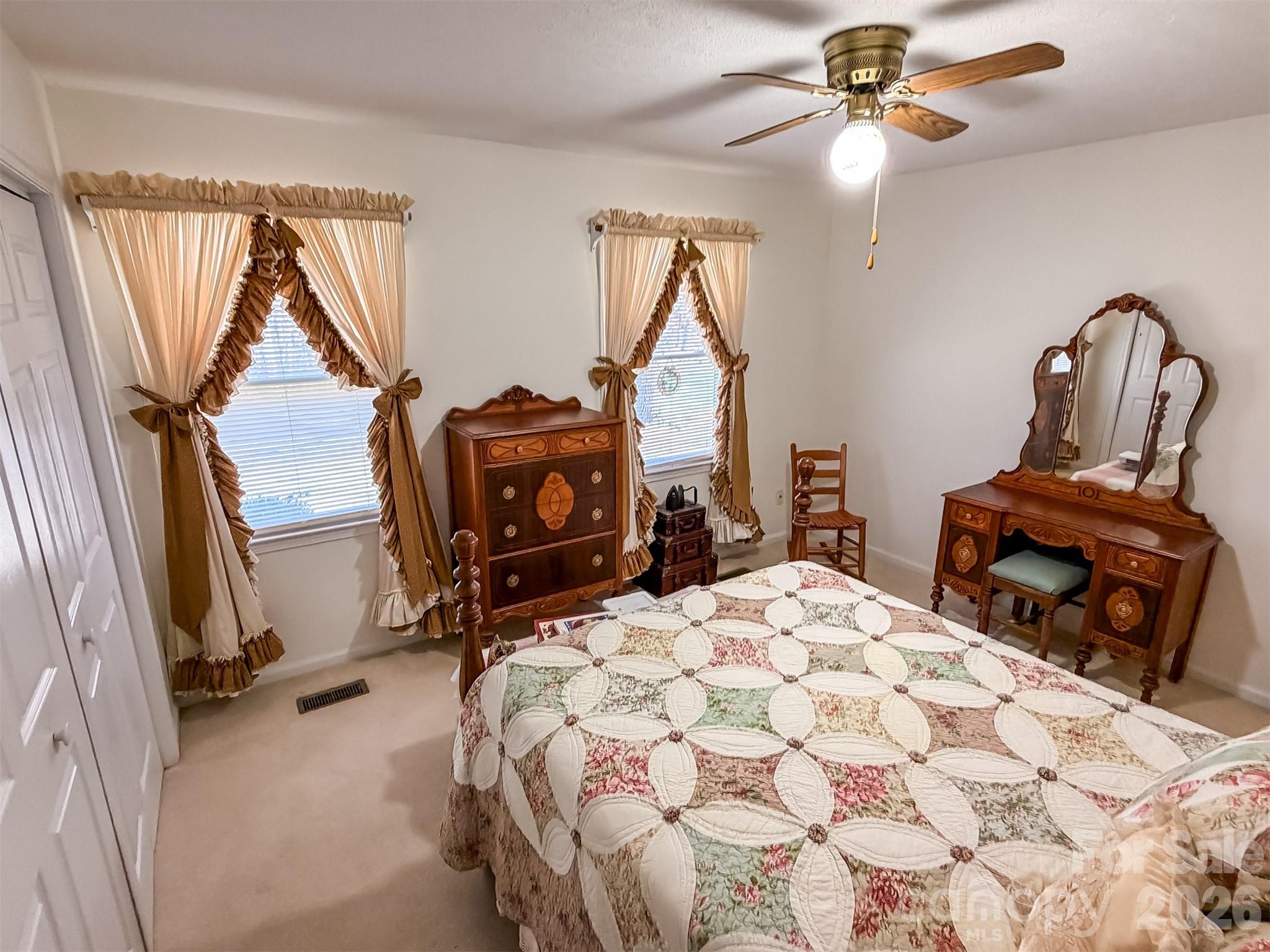 1017 3rd Avenue Northwest Conover, NC 28613 - Photo 40 of 46 a bedroom with a bed a flat screen tv and a chandelier