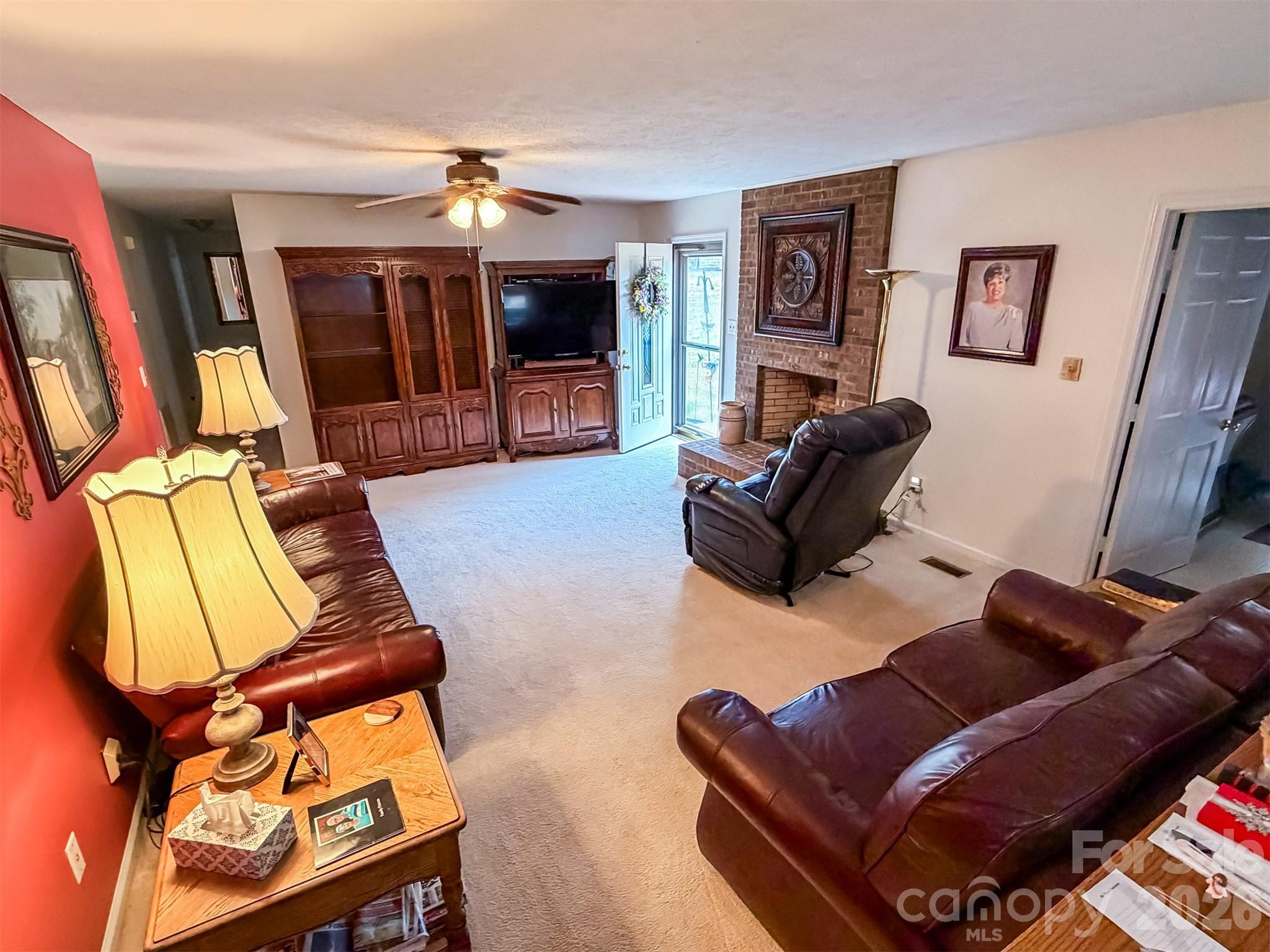 1017 3rd Avenue Northwest Conover, NC 28613 - Photo 8 of 46 a living room with furniture and a flat screen tv