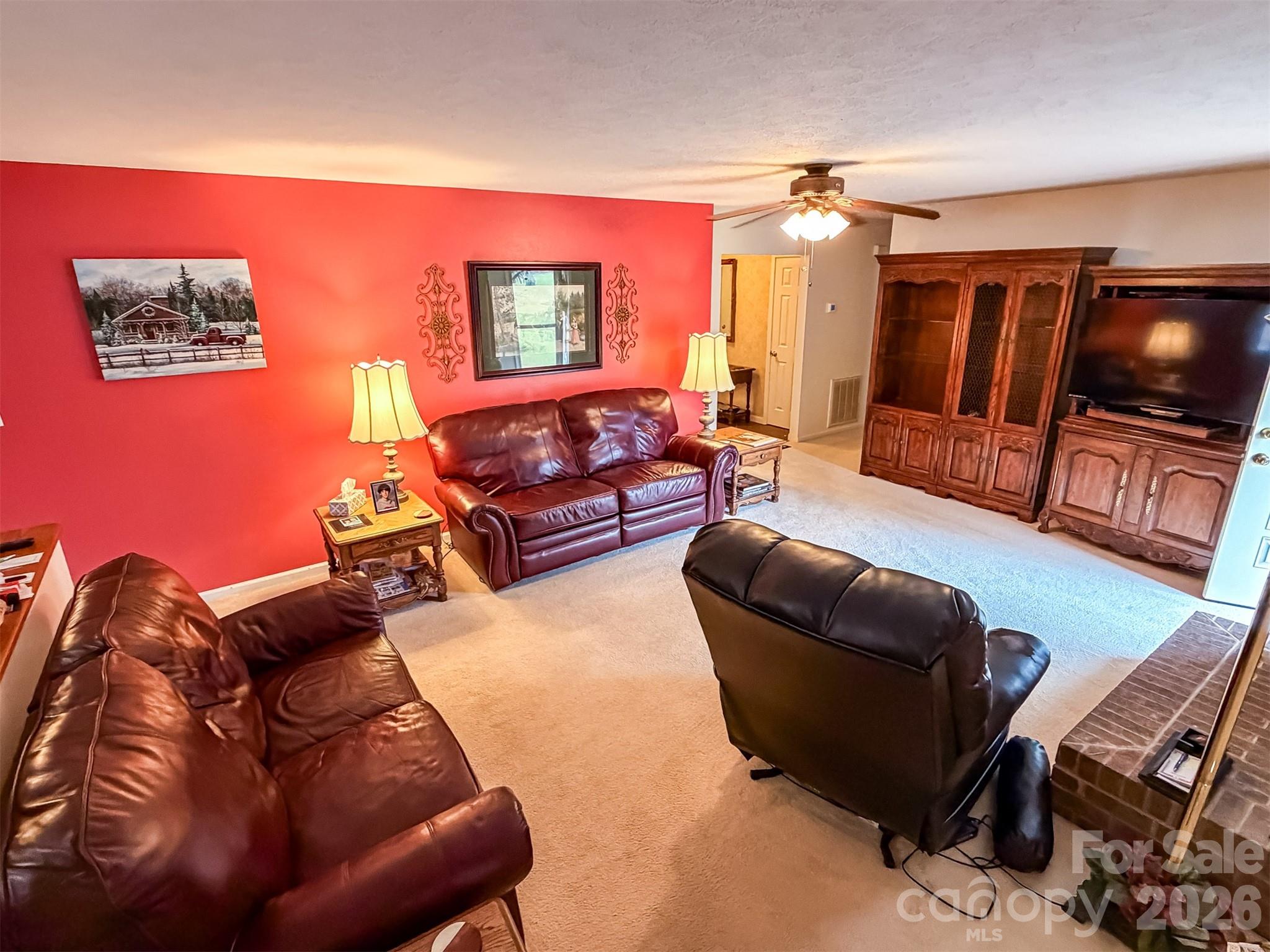 1017 3rd Avenue Northwest Conover, NC 28613 - Photo 9 of 46 a living room with furniture a flat screen tv and a couch
