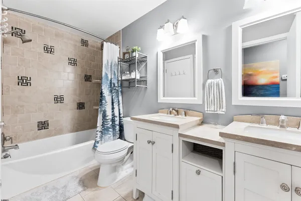 a bathroom with a sink a toilet and a bathtub