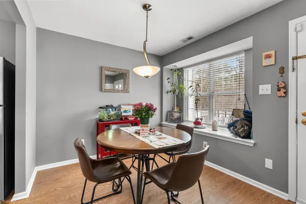 a view of a dining room with furniture window and outside view