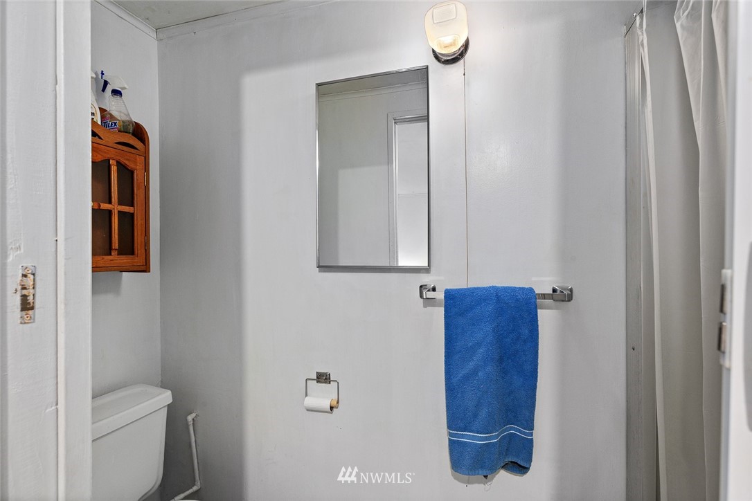 6960 Maxwelton Road Clinton, WA 98236 - Photo 17 of 40 a bathroom with a toilet and a sink