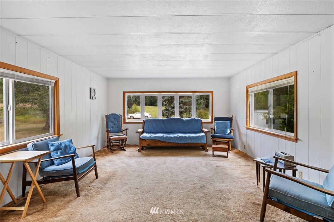6960 Maxwelton Road Clinton, WA 98236 - Photo 22 of 40 a living room with furniture and a window