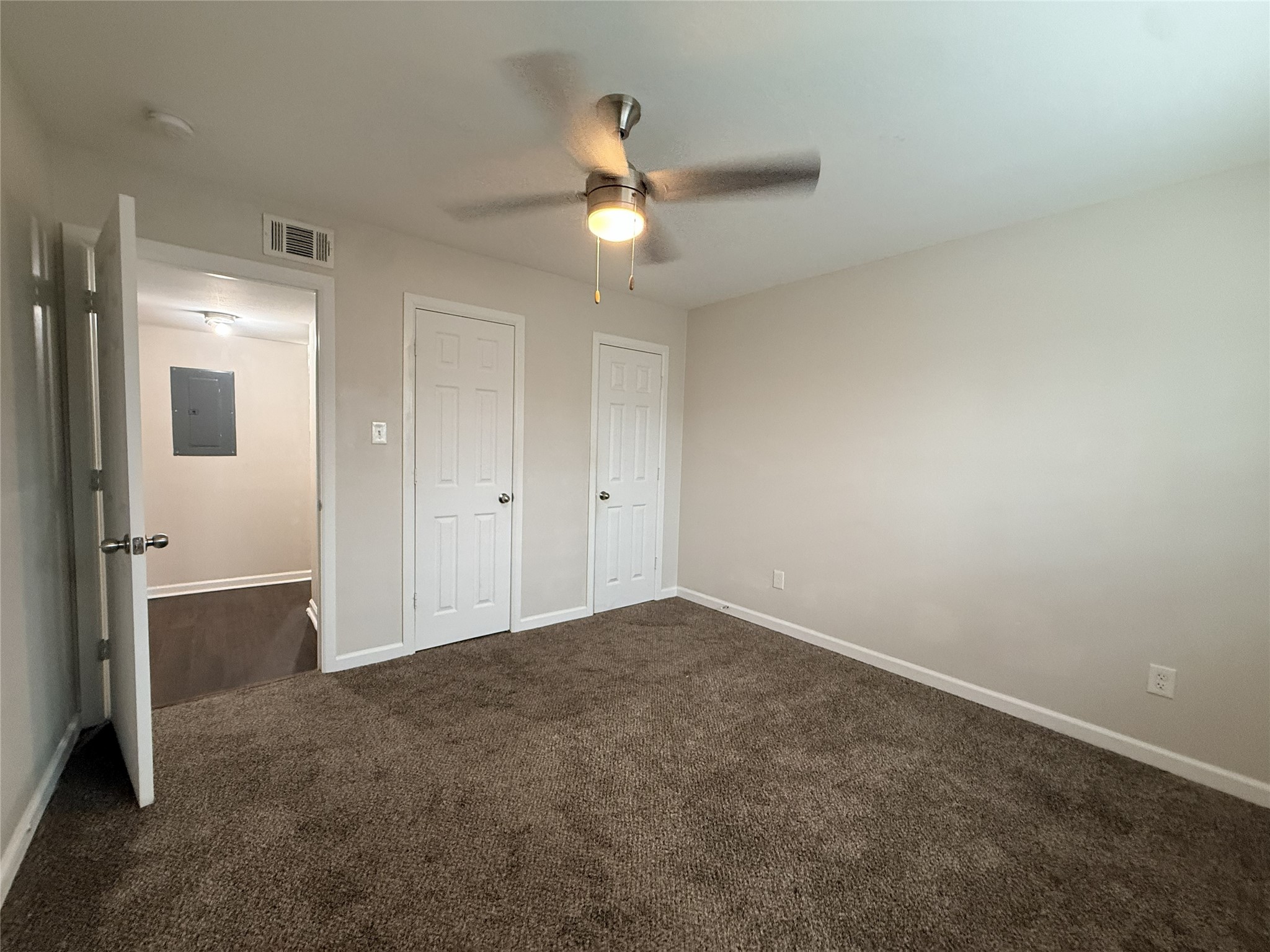 1824 Thonig Road, Unit 4 Houston, TX 77055 - Photo 13 of 13 an empty room with closet and a chandelier fan