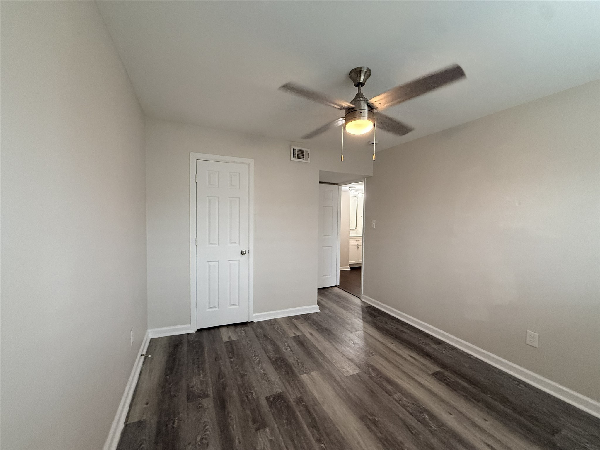 1824 Thonig Road, Unit 4 Houston, TX 77055 - Photo 10 of 13 wooden floor in an empty room with a window