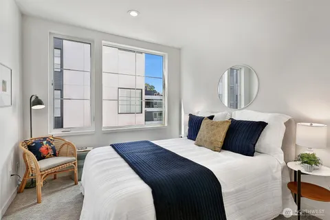 a bedroom with bed and window