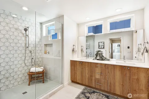 a spacious bathroom with a sink and a mirror