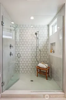 a bathroom with a sink and shower