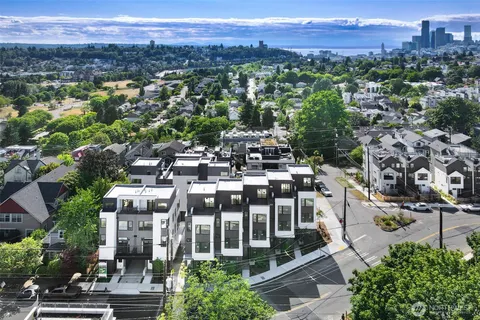 a view of a patio with table and chairs and potted plants