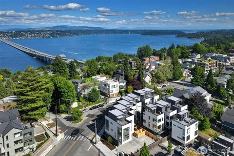 a view of building along with deck and outdoor seating