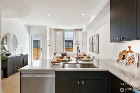 a kitchen with a sink and a refrigerator