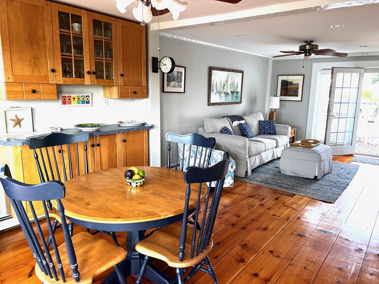4 Race Point Road Mashpee, MA 02649 - Photo 17 of 37 a outdoor dining space with furniture and wooden floor