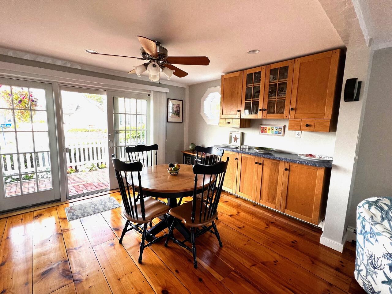 4 Race Point Road Mashpee, MA 02649 - Photo 19 of 37 a dining room with furniture a chandelier and wooden floor