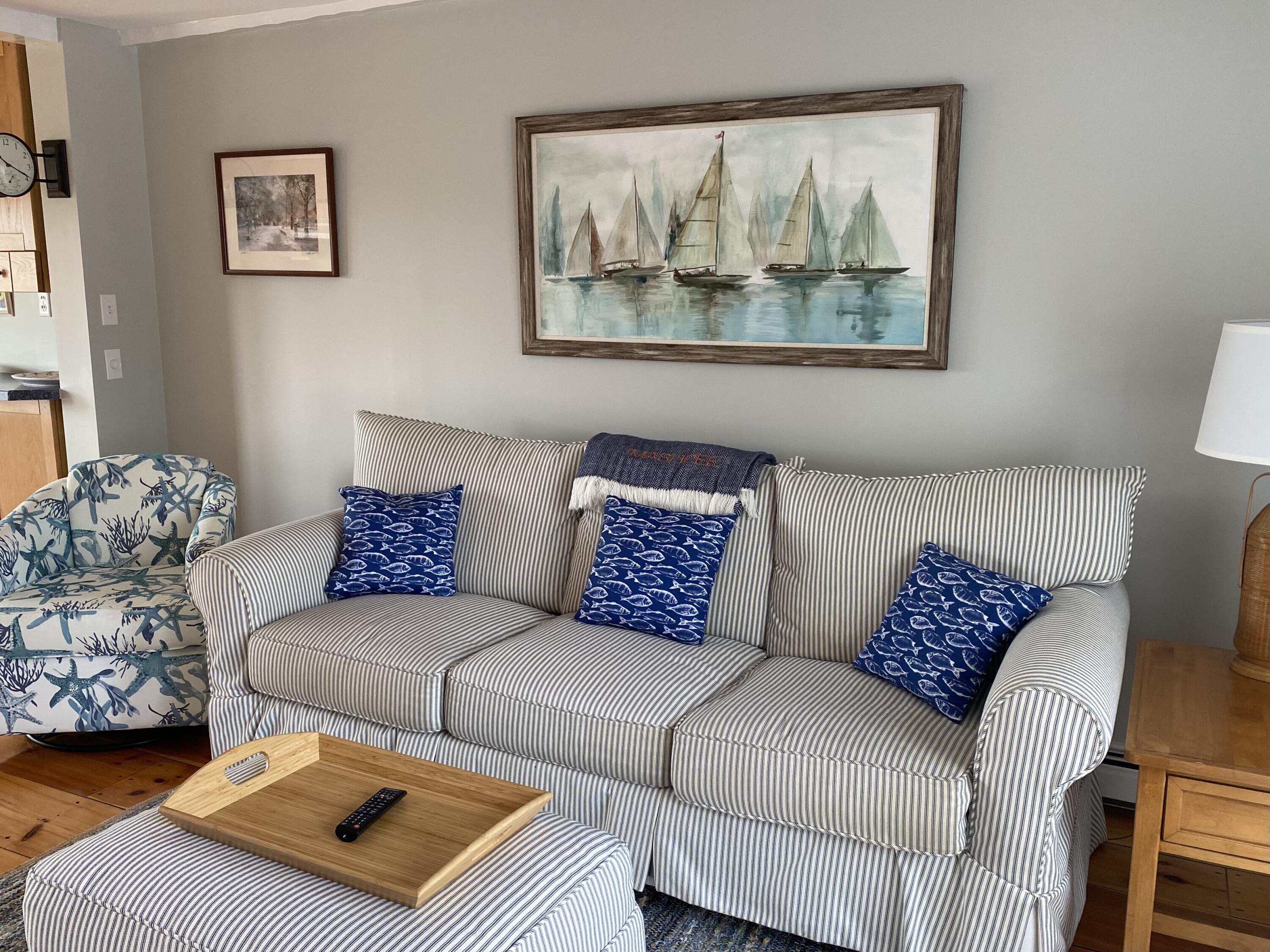 4 Race Point Road Mashpee, MA 02649 - Photo 23 of 37 a living room with a couch and a painting on the wall