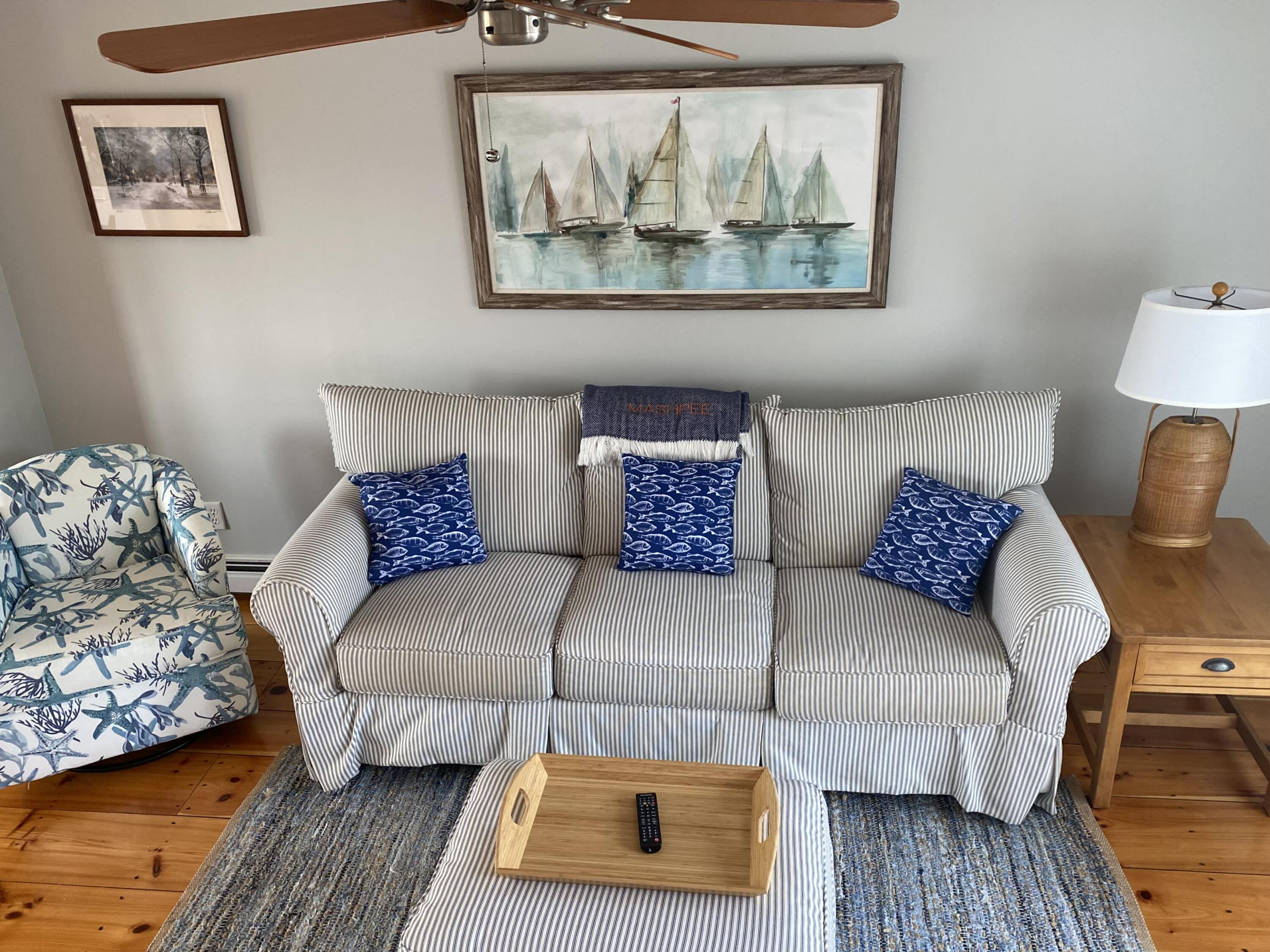 4 Race Point Road Mashpee, MA 02649 - Photo 24 of 37 a living room with a couch and a wooden floor
