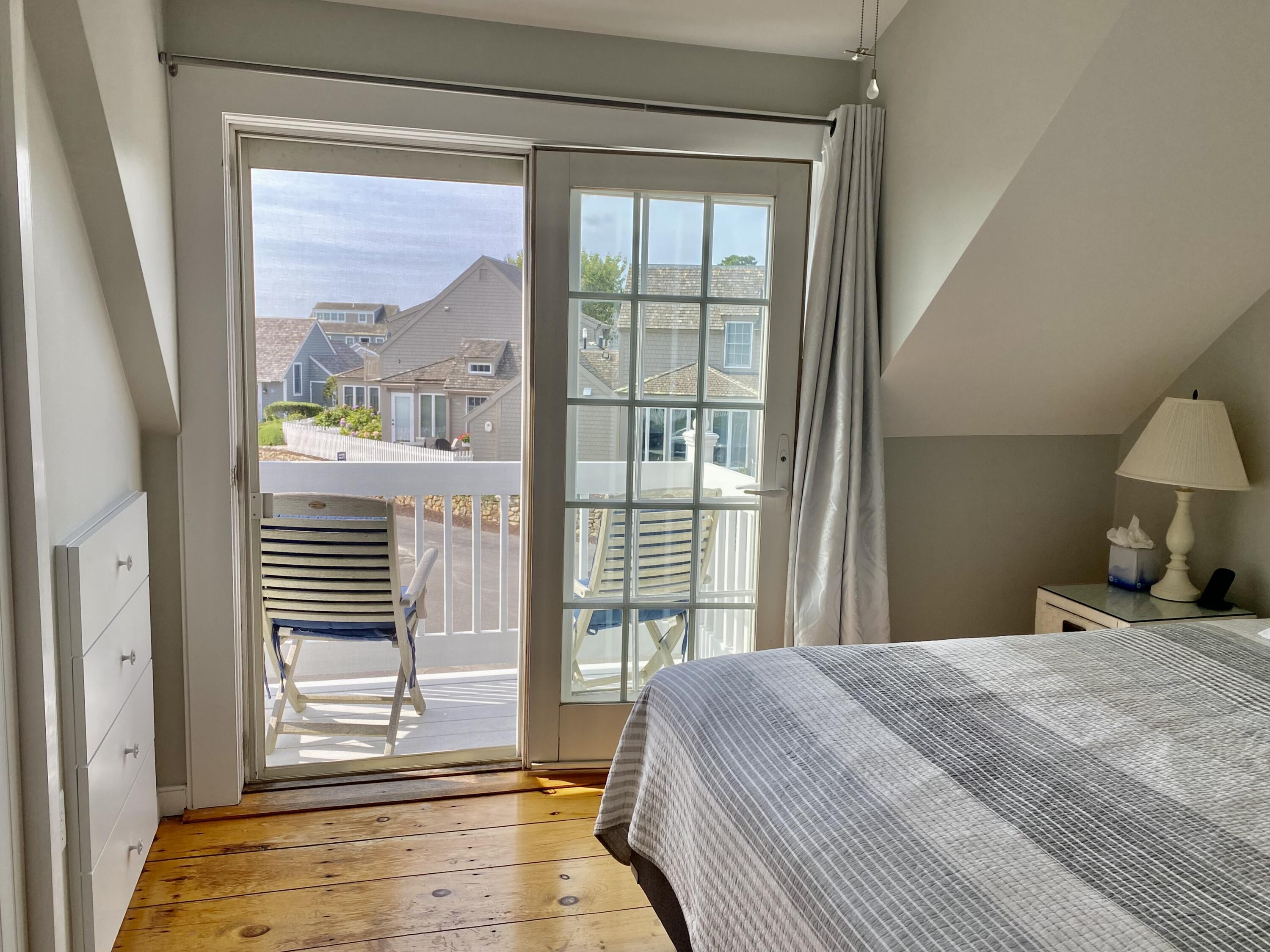 4 Race Point Road Mashpee, MA 02649 - Photo 30 of 37 a bedroom with a bed and a window