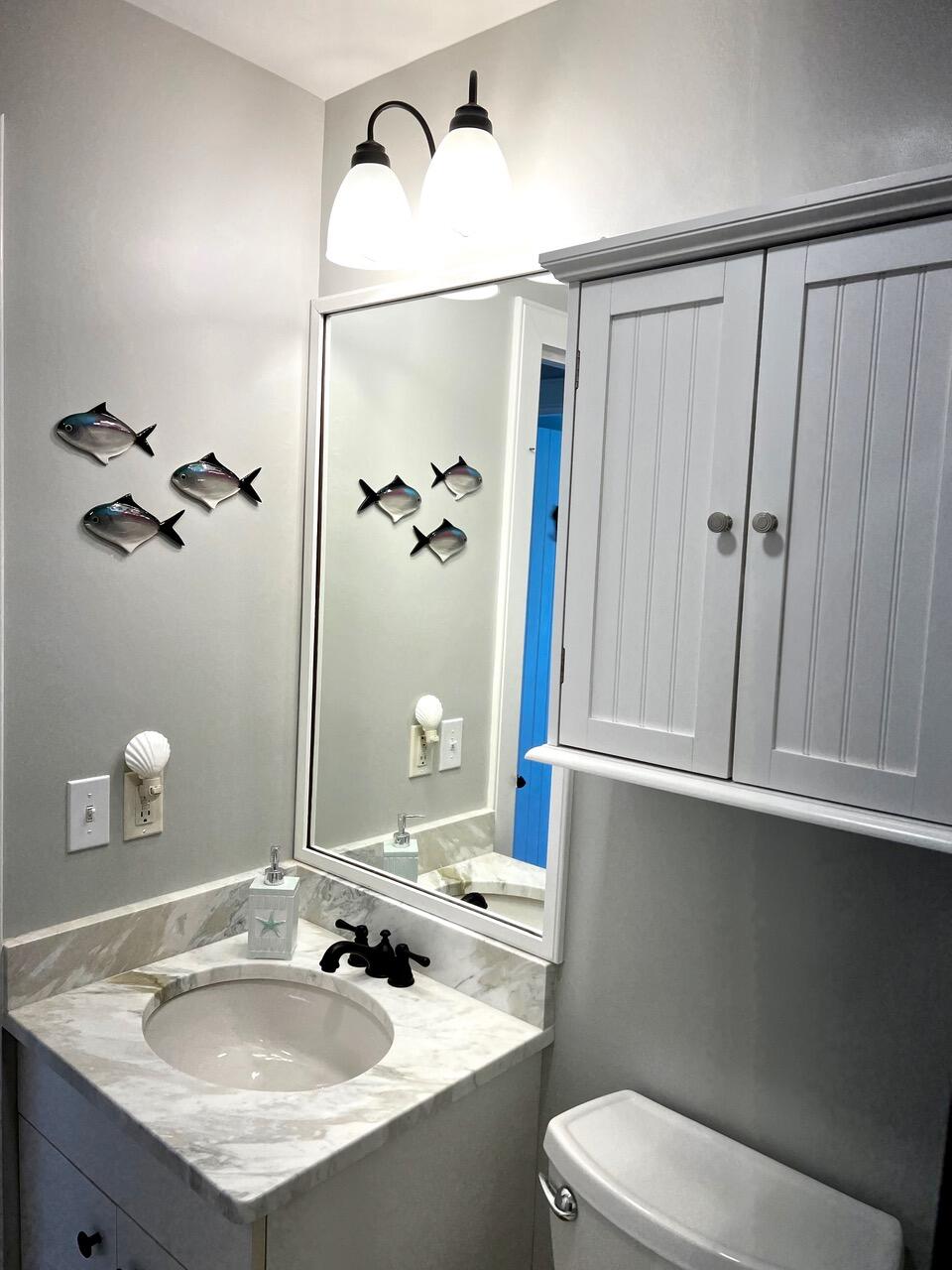 4 Race Point Road Mashpee, MA 02649 - Photo 34 of 37 a bathroom with a sink toilet and shower