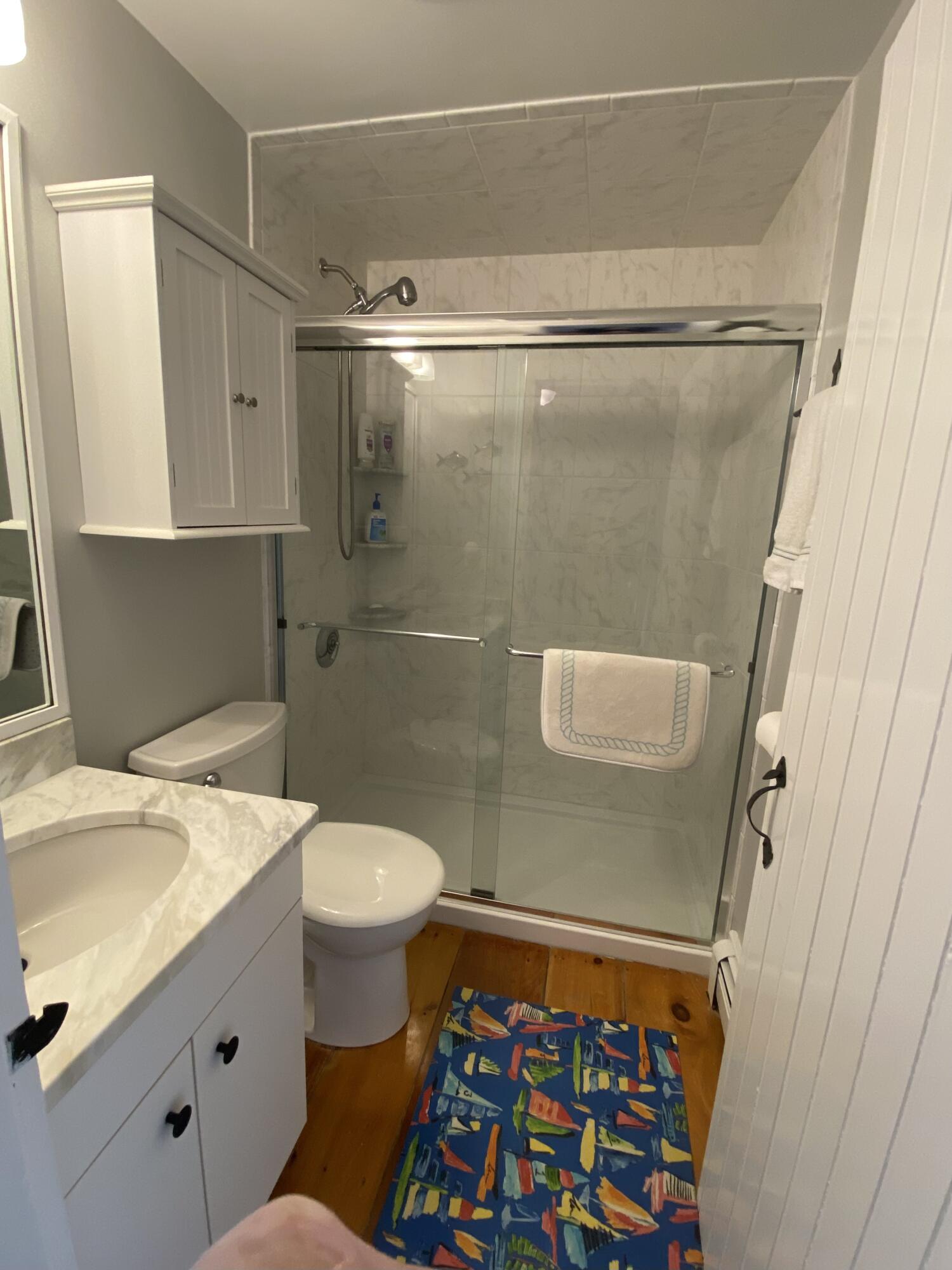 4 Race Point Road Mashpee, MA 02649 - Photo 35 of 37 a bathroom with a sink a toilet and shower