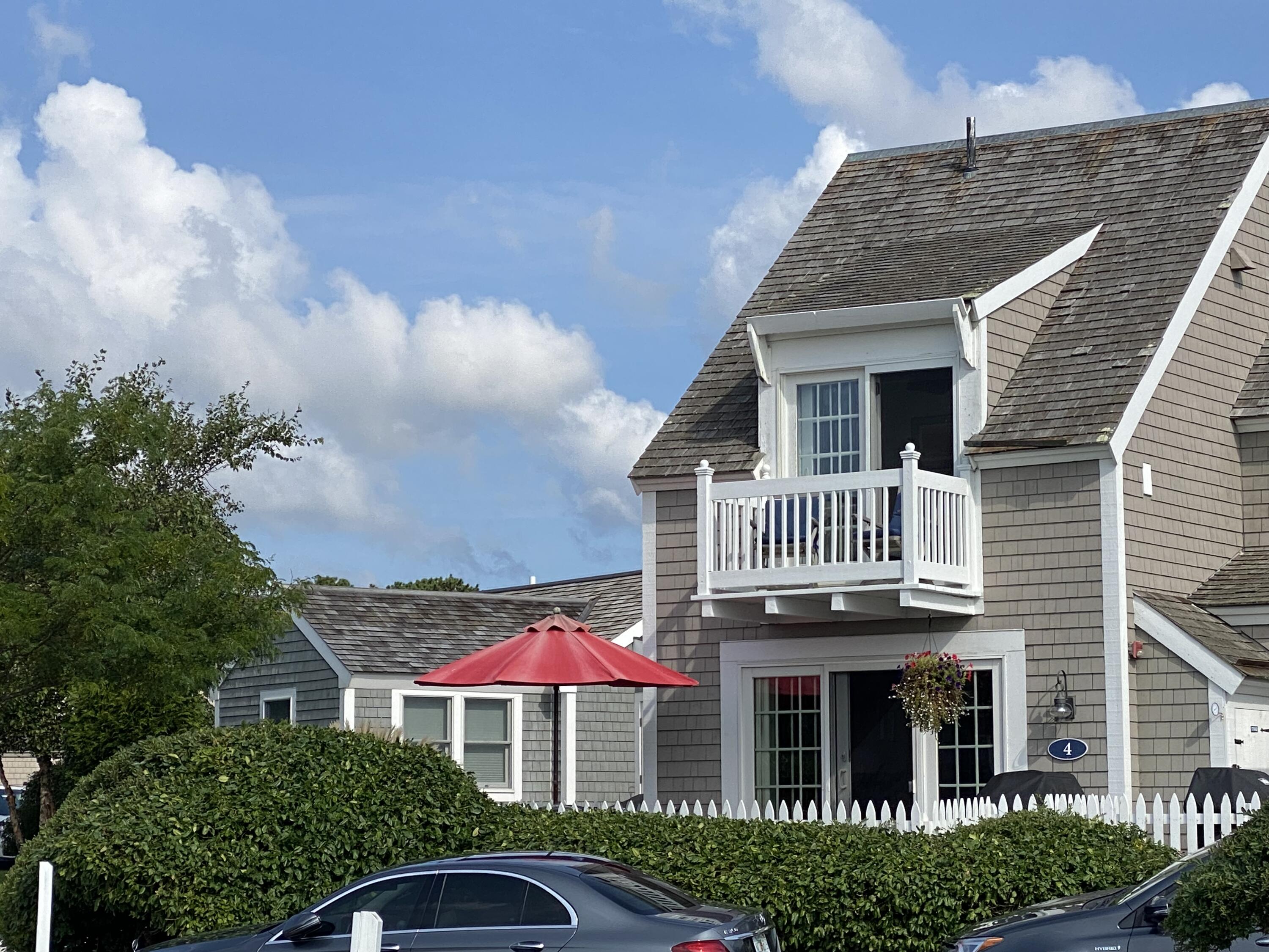 4 Race Point Road Mashpee, MA 02649 - Photo 7 of 37 a front view of a house with a yard