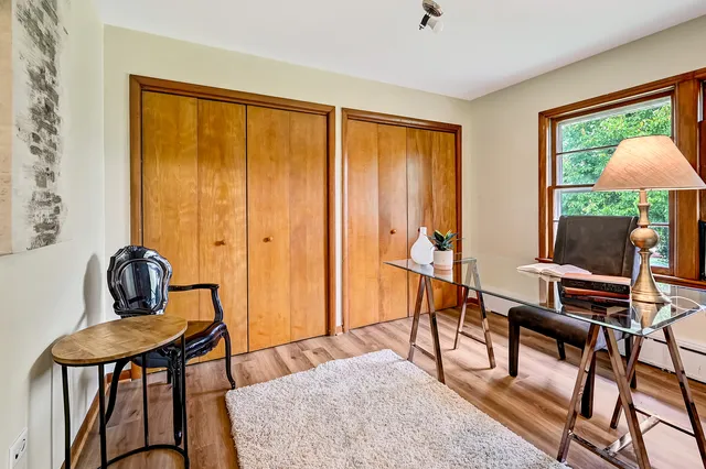 a bathroom with a sink a toilet a mirror and bathtub