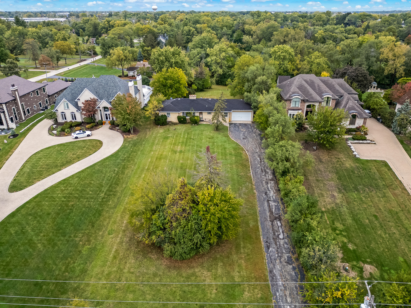 219 79th Street Burr Ridge, IL 60527 - Photo 22 of 28 an aerial view of residential houses with outdoor space and trees