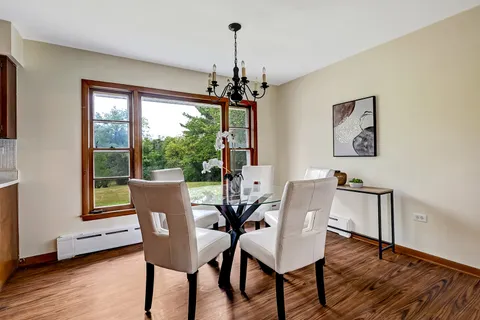 a dining room with furniture window wooden floor