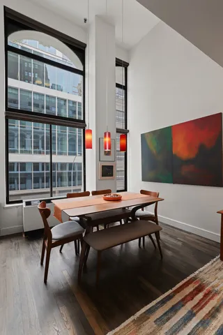 a dinning table and chairs in a room