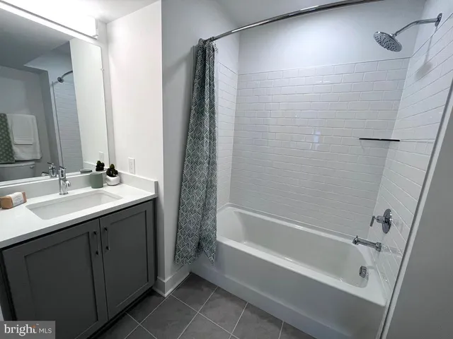 a bathroom with a bathtub and a sink