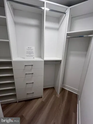 a view of an empty walk in closet