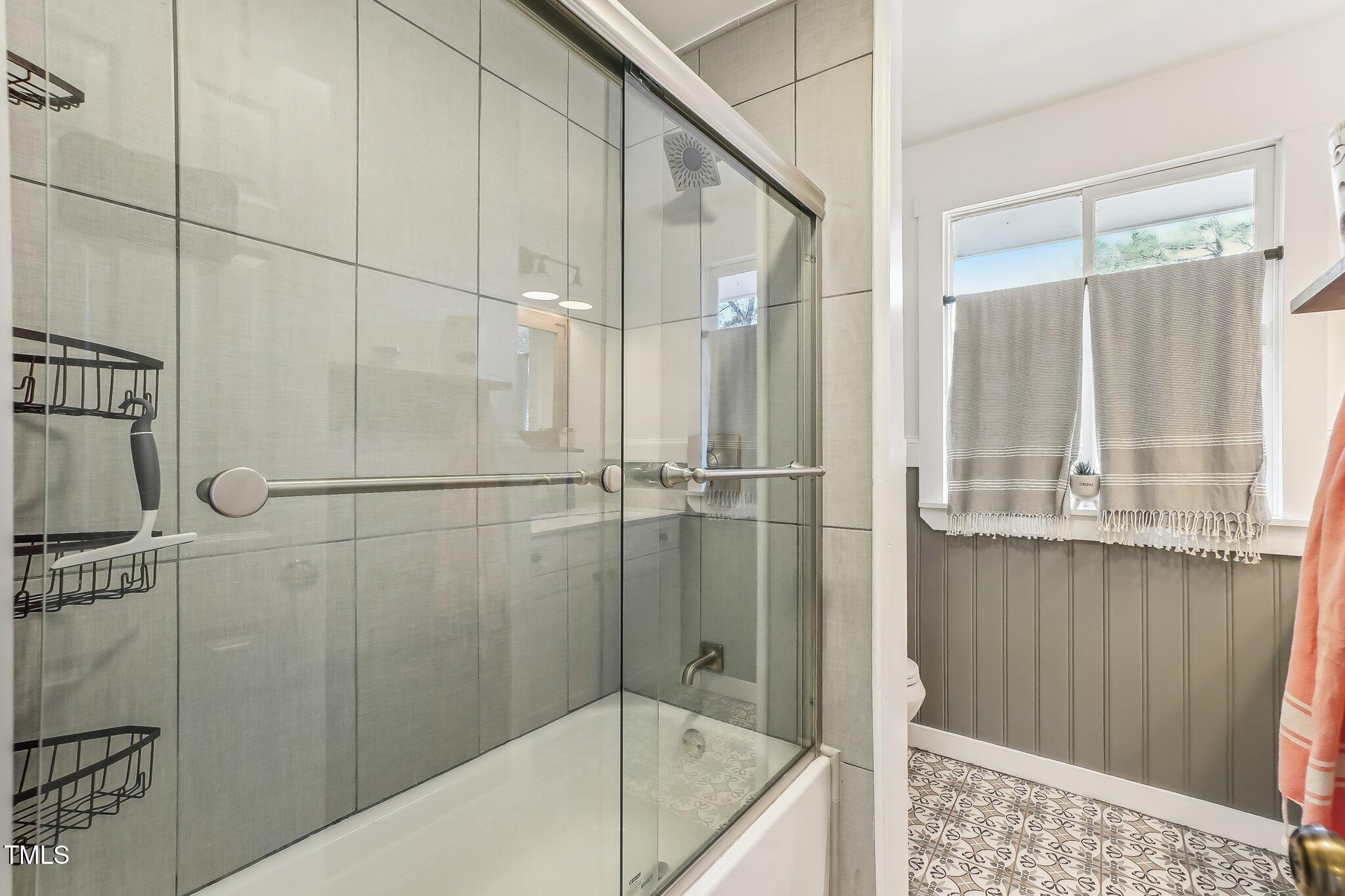 5410 Thayer Drive Raleigh, NC 27612 - Photo 23 of 36 a bathroom with a shower and a shower