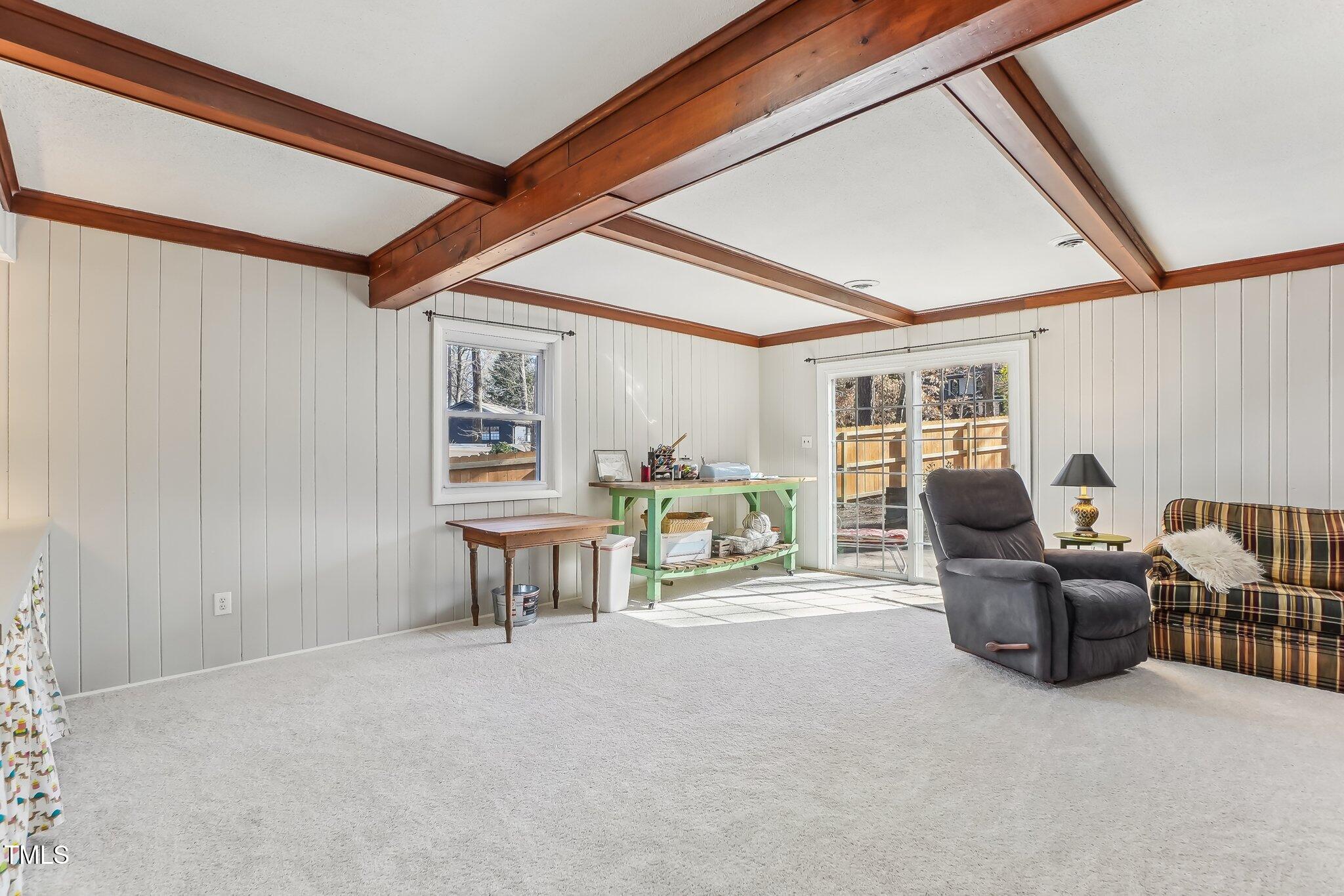 5410 Thayer Drive Raleigh, NC 27612 - Photo 26 of 36 a living room with furniture and a window