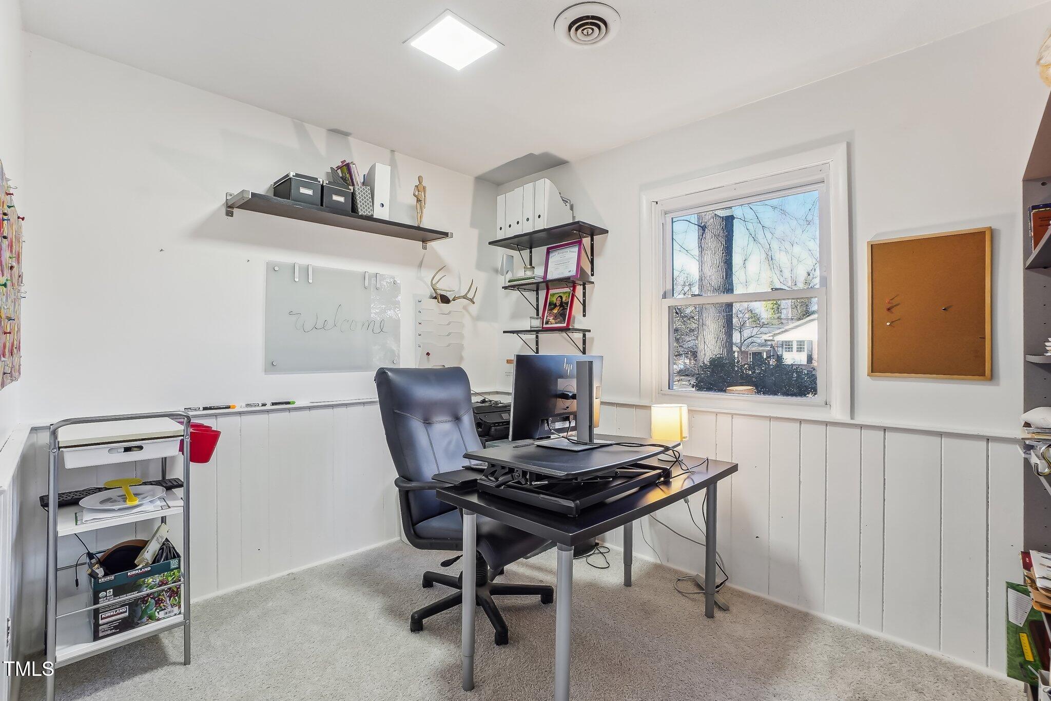 5410 Thayer Drive Raleigh, NC 27612 - Photo 29 of 36 a view of a workspace with furniture and a window