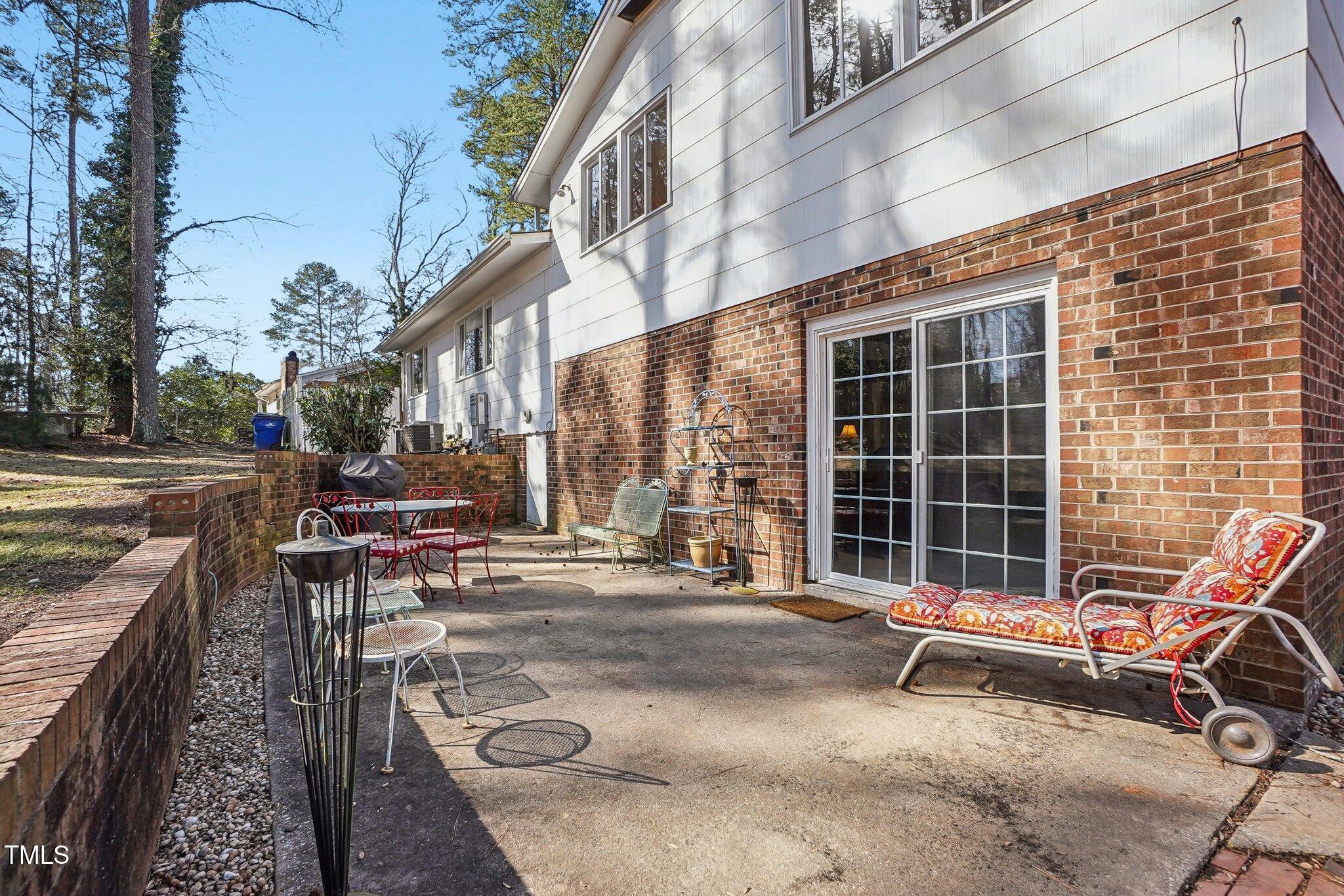 5410 Thayer Drive Raleigh, NC 27612 - Photo 32 of 36 a bench is sitting in front of a building