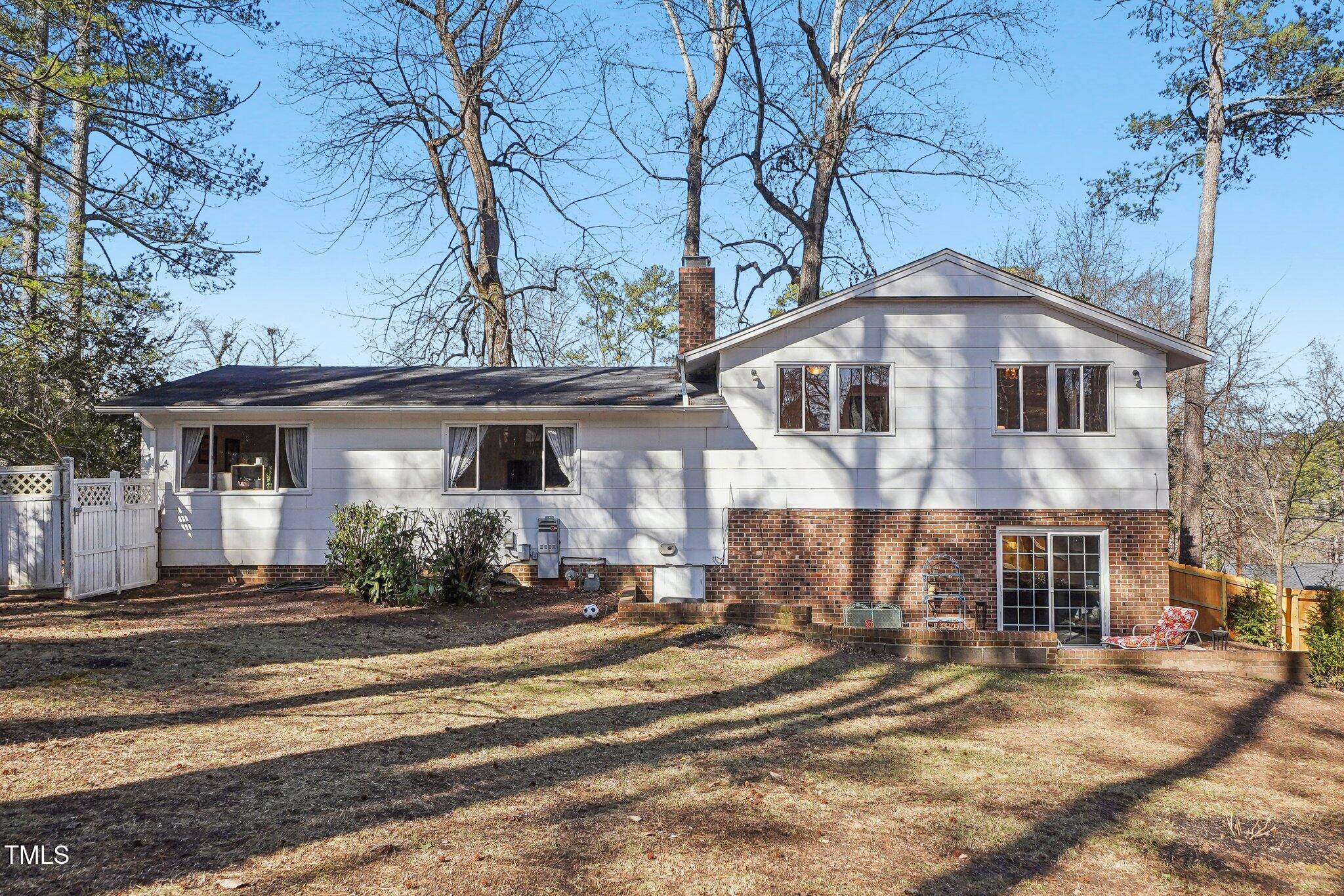 5410 Thayer Drive Raleigh, NC 27612 - Photo 33 of 36 a front view of a house with a yard