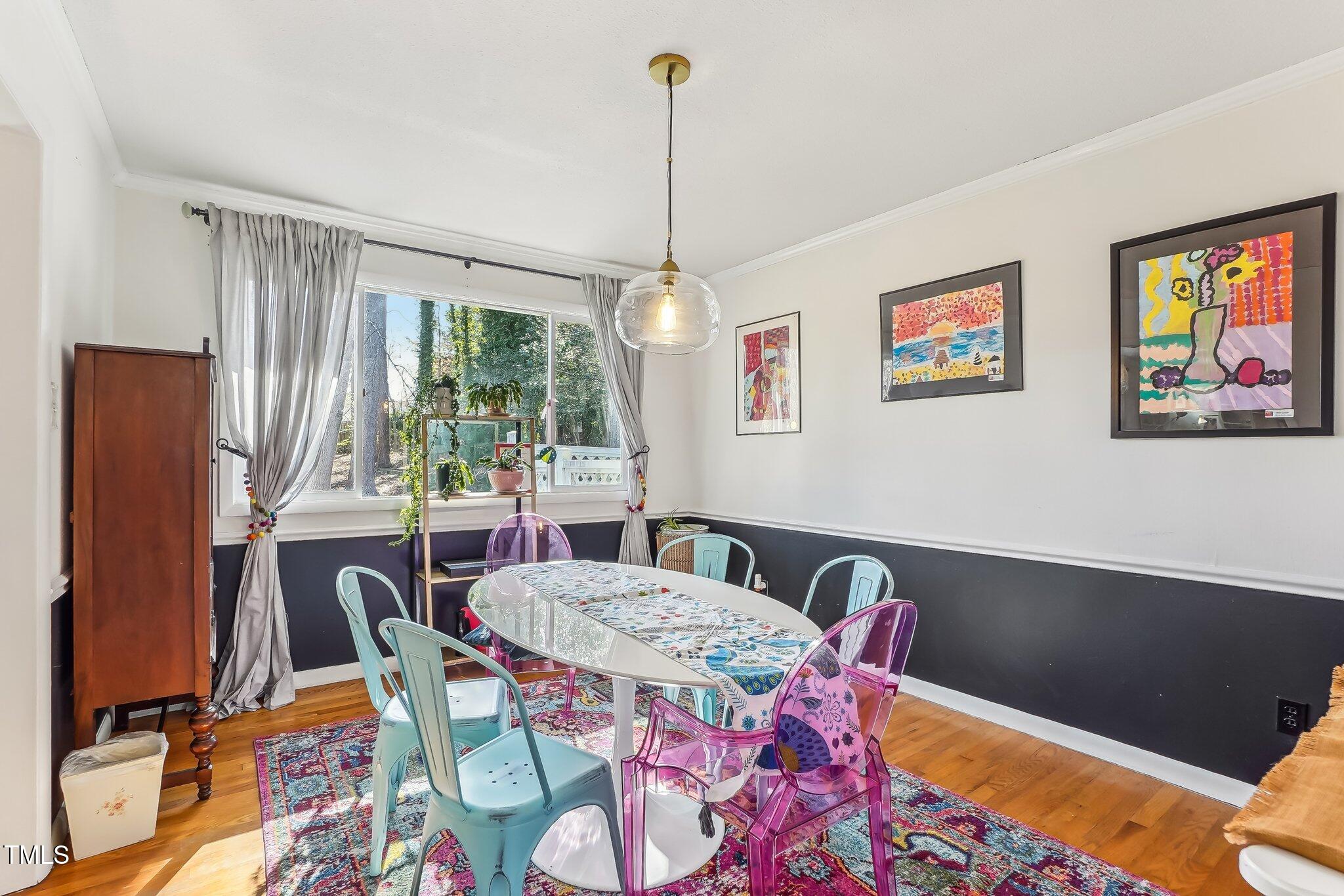 5410 Thayer Drive Raleigh, NC 27612 - Photo 10 of 36 a view of a dining room with furniture window and outside view