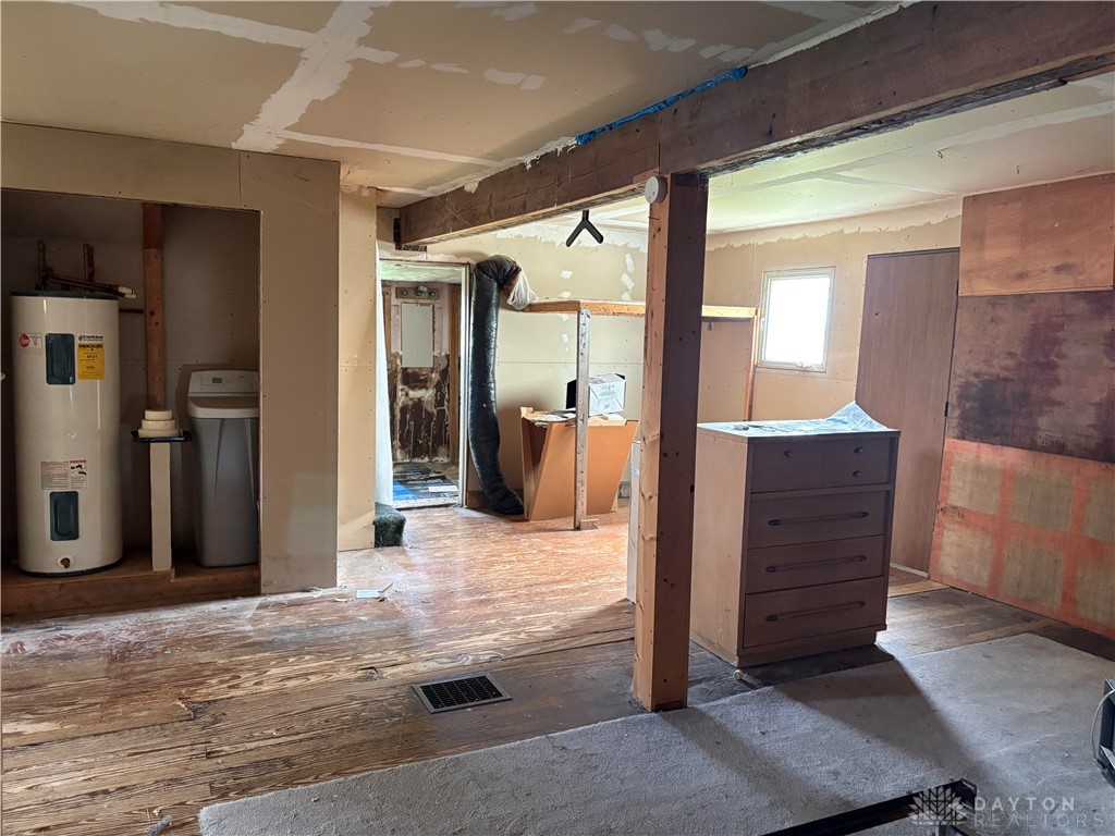 9006 Oakes Road Arcanum, OH 45304 - Photo 24 of 29 This interior space features exposed wooden beams and a blend of flooring textures.