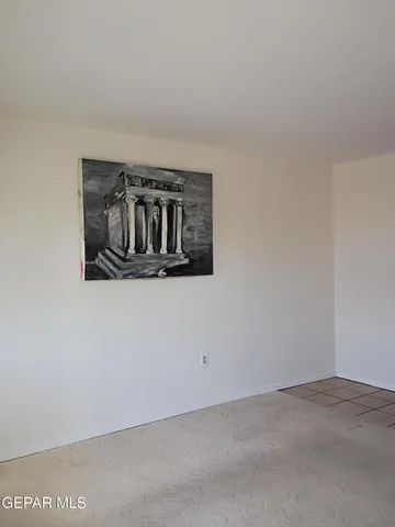a bathroom with a toilet and a shower curtain