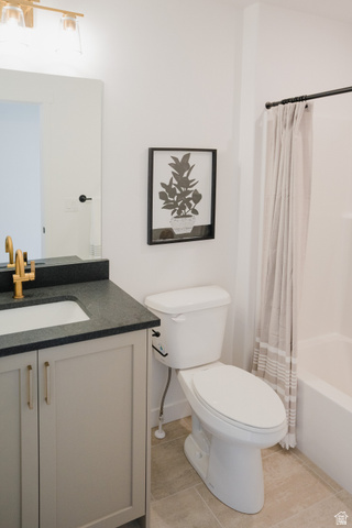 2012 West 1150 South, Unit 1018 Payson, UT 84651 - Photo 13 of 25 Bathroom with shower / bath combo with shower curtain, vanity, and light tile patterned flooring