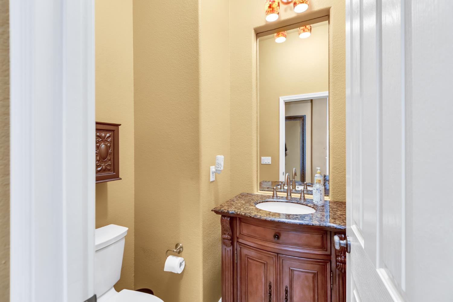 9601 Stablegate Road Wilton, CA 95693 - Photo 13 of 92 a bathroom with a granite countertop sink toilet and shower